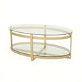 Table basse ovale moderne en verre trempé avec piètement en fer forgé.
