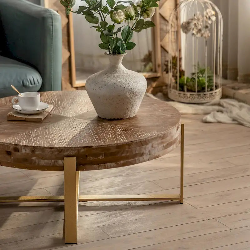 31.29 Table basse ronde, plateau en bois de sapin avec piètement croisé doré